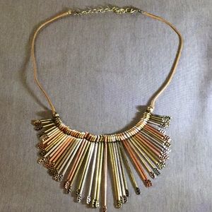 Necklace that has gold, bronze, and silver!